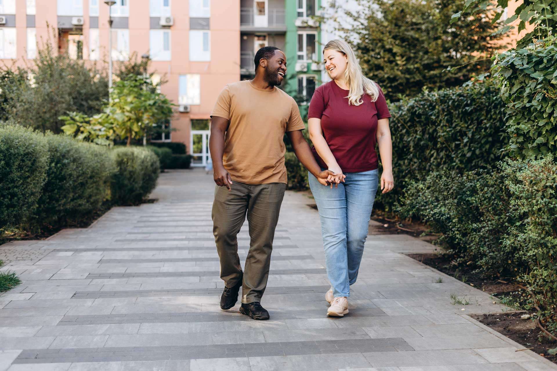 Couple walking hand in hand outdoors